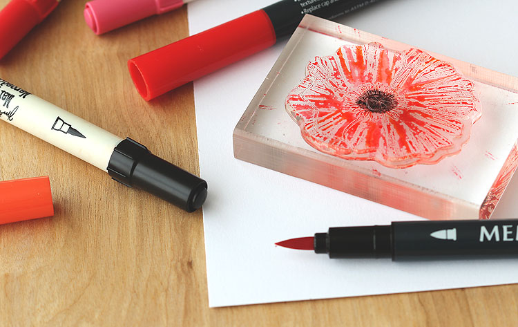 Color with markers directly on a stamp, mist lightly and you'll get a pretty poppy texture! by Lisa Spangler